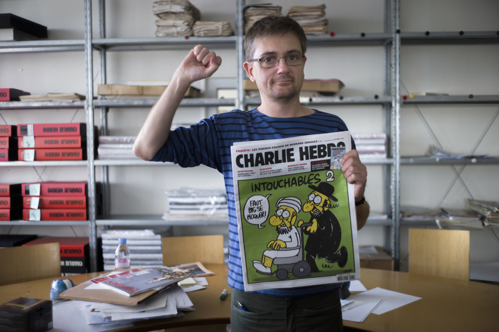 Foto: Stéphane Charbonnier nella redazione di Charlie Hebdo (Fred Dufour, Afp/Getty Images)